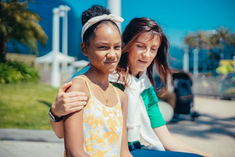 Therapeutic foster parent supporting adolescent with mental health binder during home visit