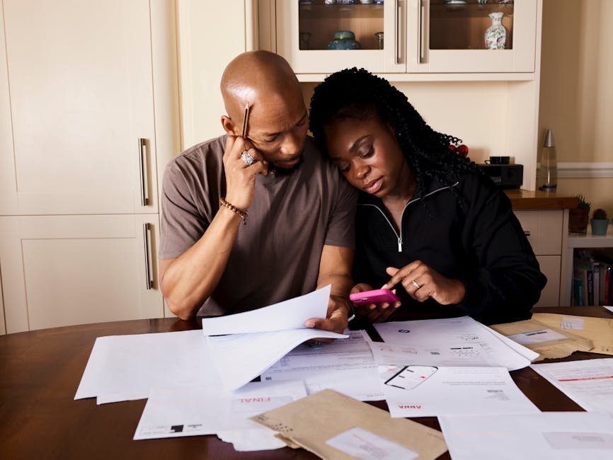 Family reviewing healthcare bills and out-of-pocket maximum calculations at home