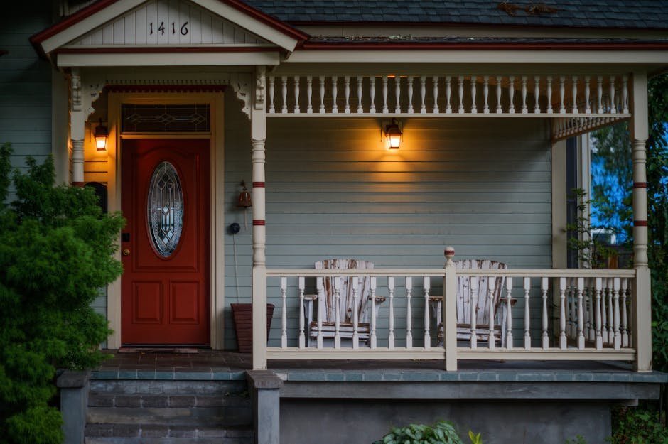 Welcoming front porch of a peer-run respite house with two chairs and a small table